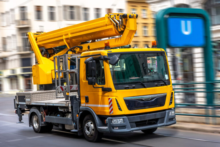 yellow utility truck with hydraulic lift urban infrastructure (1)